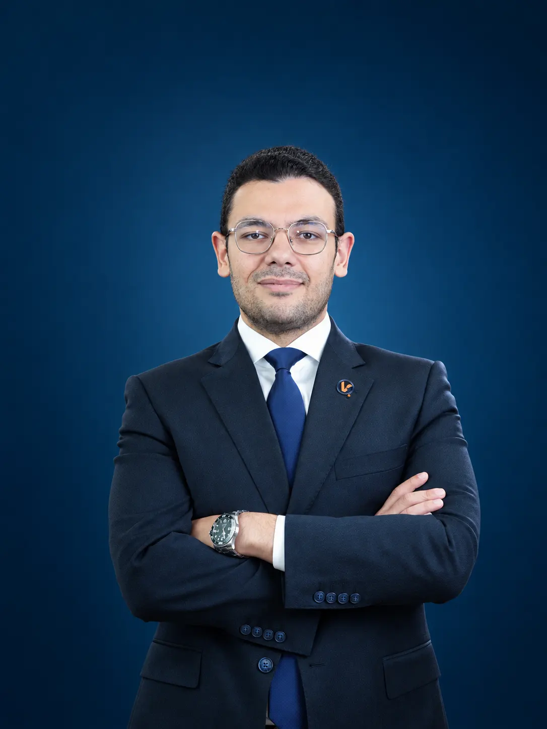 Veer & Sant property consultant in a navy suit, Dubai office team